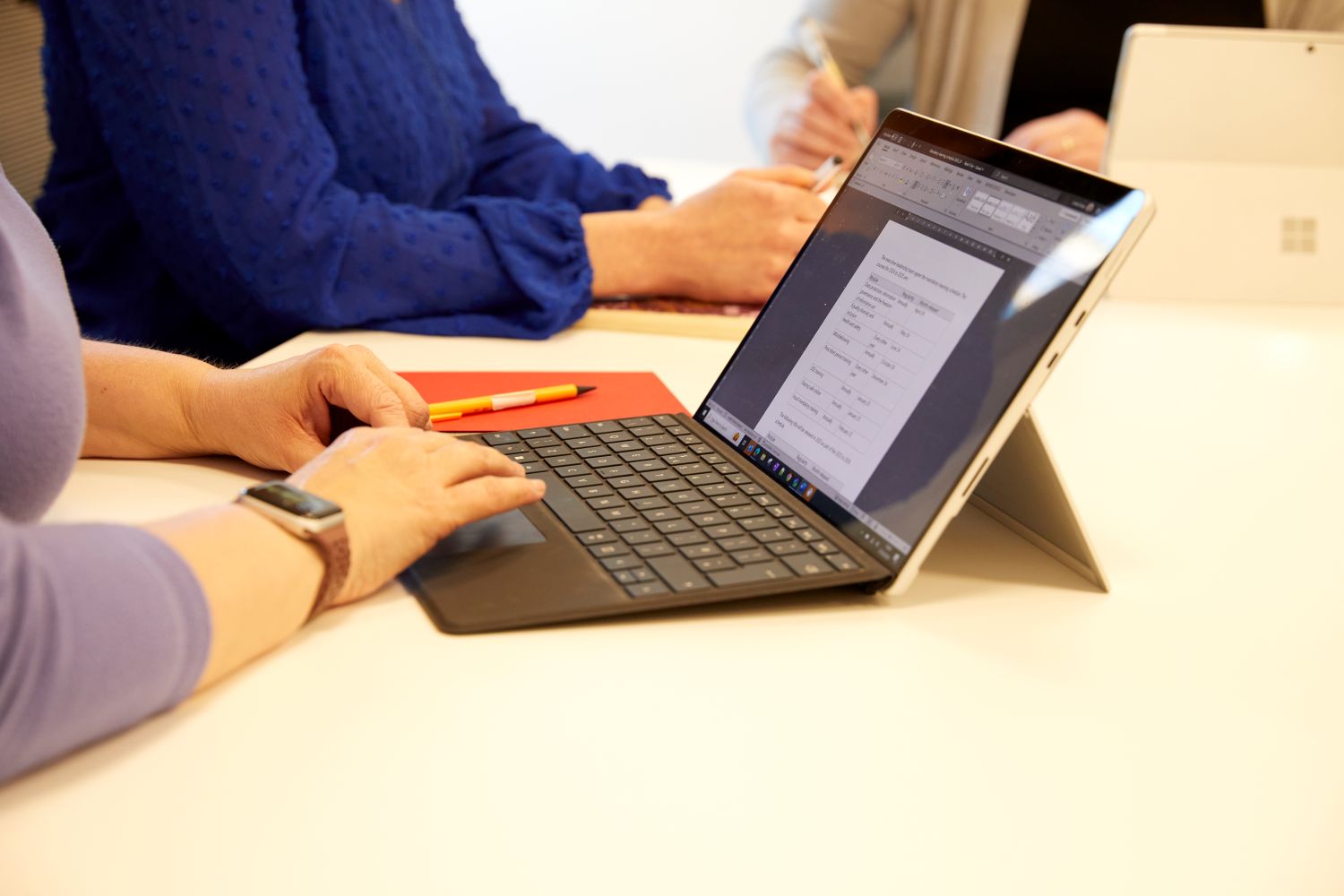 Someone typing on a laptop