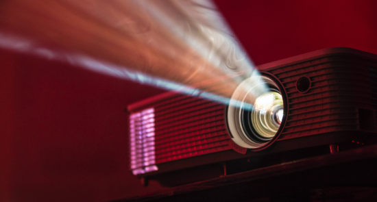 close up of projector lense playing)