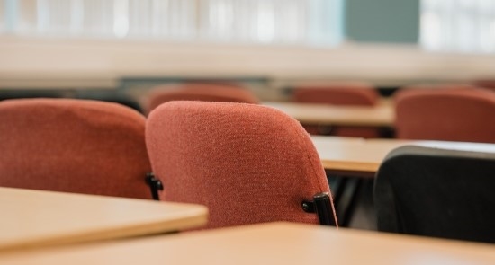 A row of chairs and desks)