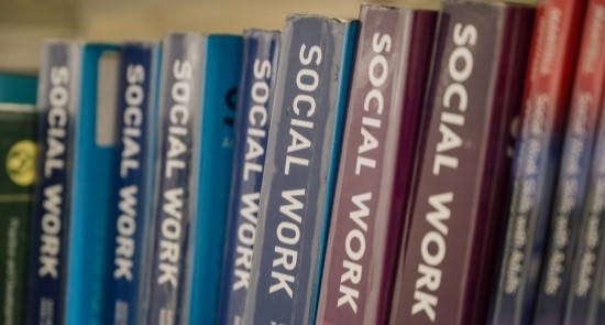 Row of social work books)